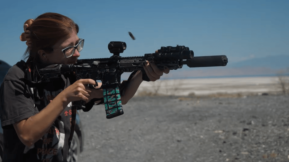 Suppressed AR-15 ejecting spent brass