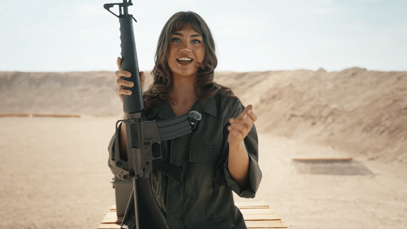 Lujan holding M16 clone rifle